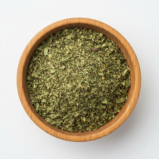 Dried mint crushed in wooden circle bowl with white background, photo size is 556px in 556 px